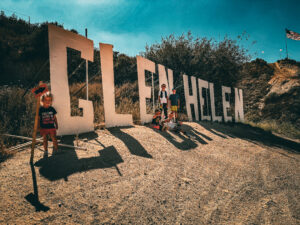 5 NXGen race kids at the Glen Helen sign