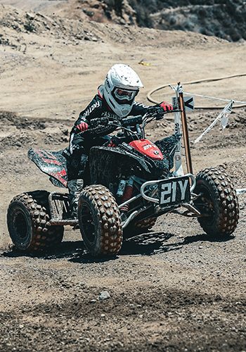 NXgen racer #21 coming through a flat left turn